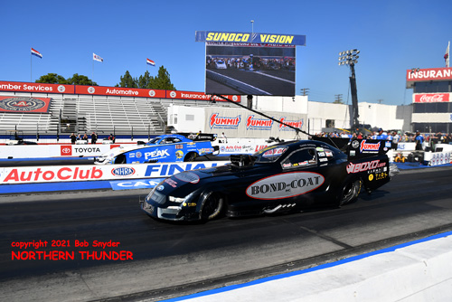 Chad Green (near lane) vs John Force 
(far lane)